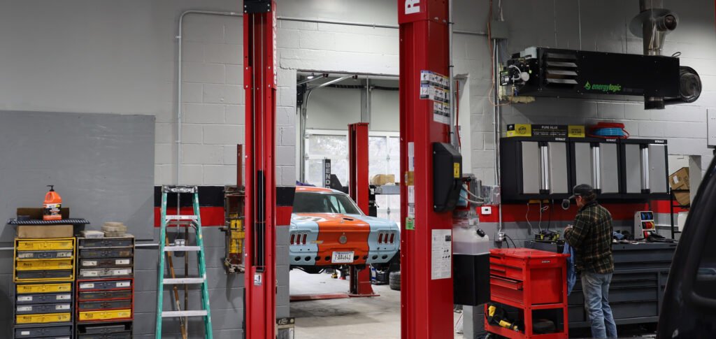 Service lifts, a vehicle and work area inside the Talus Automotive garage