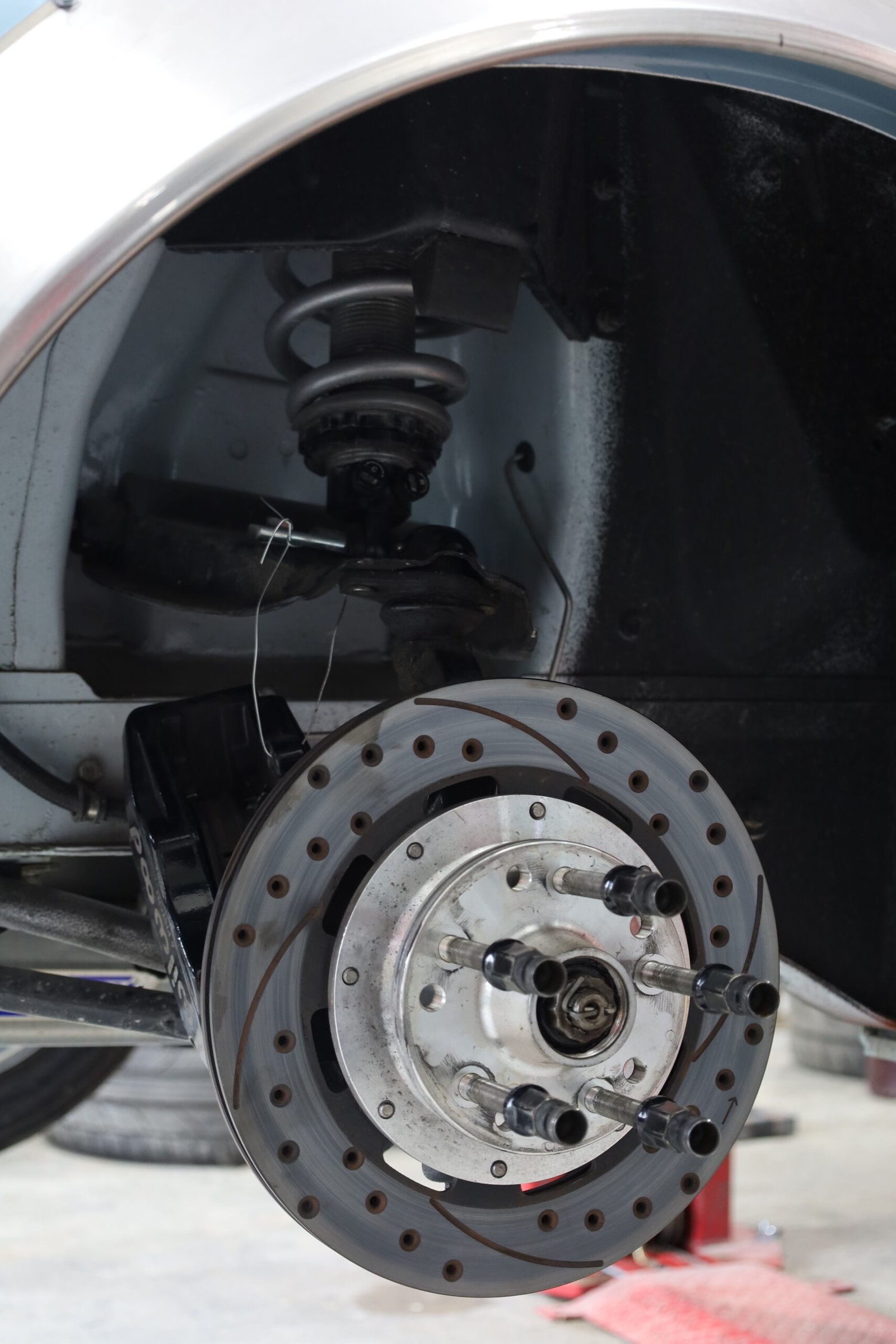 Brake and suspension components photographed at Talus Automotive